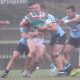 Luke Bain Rabbitoh's Lock get wrapped up by the Sharks Defense in the massive downpour at Redfern Oval on Sunday in the NSWRL Jersey Flegg Cup Season opener (Photo : Steve Montgomery)
