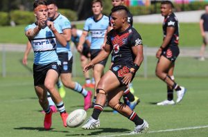 Sione Moala NZ Warriors halfback kicks his team into attack sgBall r4 v Sharks (Photo : Steve Montgomery)
