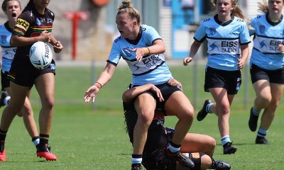 Sharks Taylah Vella unloads while being tackled in Tarsha Gale Cup game at Shark Park v the Panthers in Round 4 (Photo : Steve Montgomery)