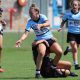 Sharks Taylah Vella unloads while being tackled in Tarsha Gale Cup game at Shark Park v the Panthers in Round 4 (Photo : Steve Montgomery)