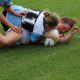 Stella Tijou battles her way to one of her 2 tries in Rnd 5 v the Sharks (Photo : Steve Montgomery)