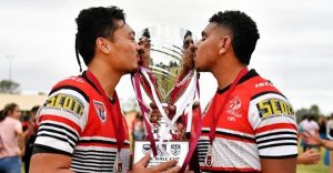 Kirwan player celebrate by kissing the Phil Hall Cup (Photo : Townsville Bulletin)