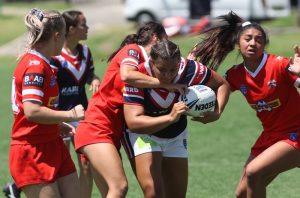 Tarsha Gale: Sydney Roosters' Tarnee Evans charges through a tackle from an Illawarra player