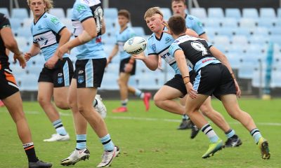 Sharks Taj Brailey unloads to a running Zane Watson in Round 4 of Harold Matthews Cup against the Balmain Tigers at Shark park (Photo : Steve Montgomery)