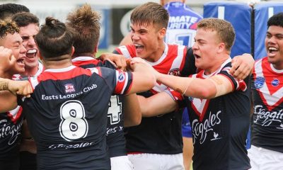 Sydney Roosters players get around Brent Hawkins after he scored the winning try
