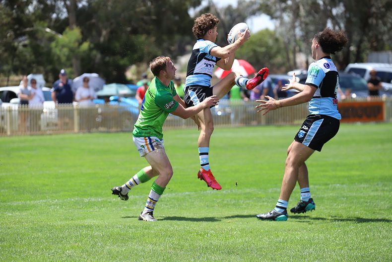 Sharks Mattys Cup winger Osca Catton jumps high to catch a good ball and fall over the line to score the Sharks 1st try v Raiders at the Raiders HQ in Canberra (Photo : Steve Montgomery)