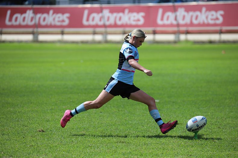 Cronulla Sharks Maddie Studdon kicking one of her 9 goals for the day (Photo : Steve Montgomery)