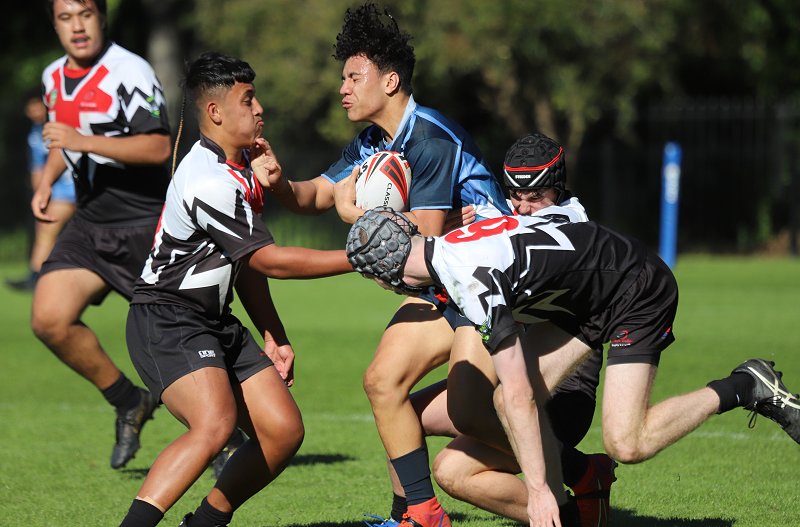Daily Telegraph reporter Willams Tyson interviews Illawarra SHS players James Walsh (L) and Viliami Mahe (Photo : Steve Montgomery)