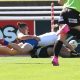 St. Dom's winger Isaac Bartolo dives in for a great try in the Schoolboy Cup against Bass HS (Photo : Steve Montgomery)