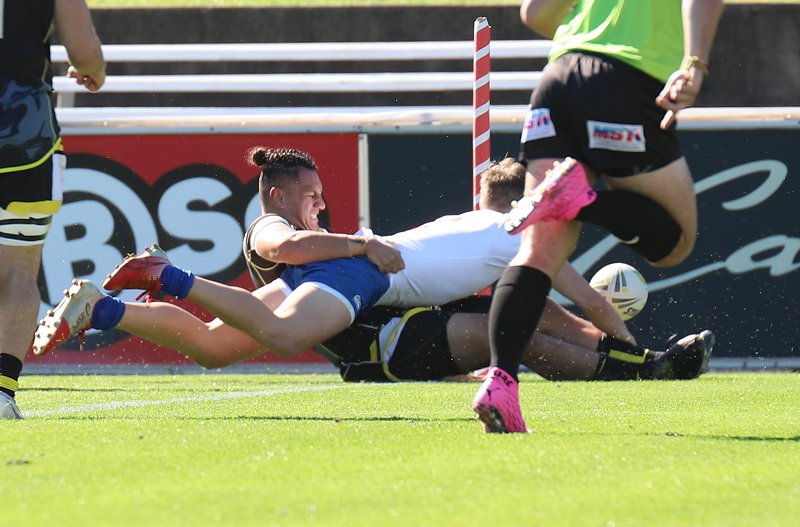 St. Dom's winger Isaac Bartolo dives in for a great try in the Schoolboy Cup against Bass HS (Photo : Steve Montgomery)