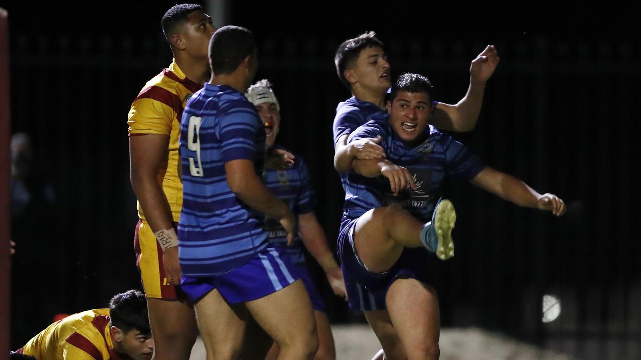Patrician Brothers Fairfield celebrate a try in their narrow win against Holy Cross College. Picture: Jonathan Ng