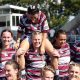 The Central Queensland Capras women's team smiling and celebrating after winning their last game of the season.(ABC Capricornia: Tobias Jurss-Lewis)