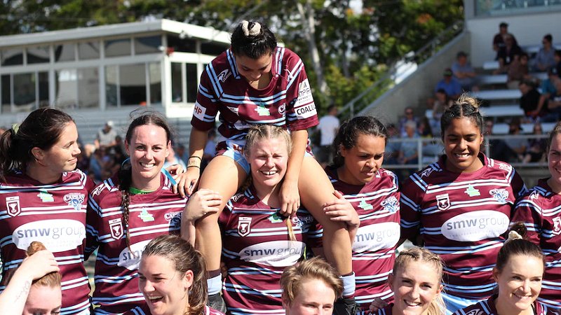The Central Queensland Capras women's team smiling and celebrating after winning their last game of the season.(ABC Capricornia: Tobias Jurss-Lewis)