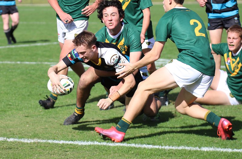 Fletcher Sharpe of All Saints College dives in for a powerful try at the Maitland Sports Ground in Rnd 2 of the Schoolboy Cup against Farrer MAHS (Photo : Steve Montgomery)