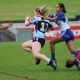 Tayla Curtis gets tackled in the Rnd 3 Tarsha Gale Cup game v Bulldogs (Photo : Steve Montgomery)