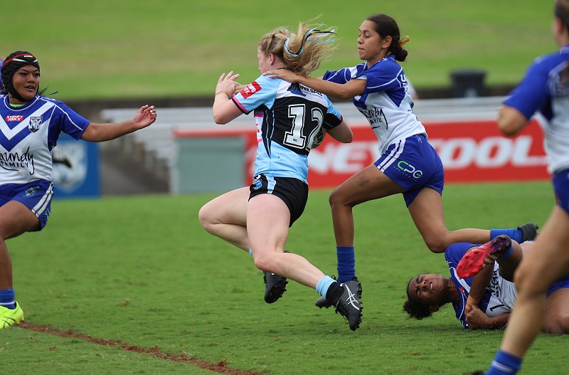 Tayla Curtis gets tackled in the Rnd 3 Tarsha Gale Cup game v Bulldogs (Photo : Steve Montgomery)