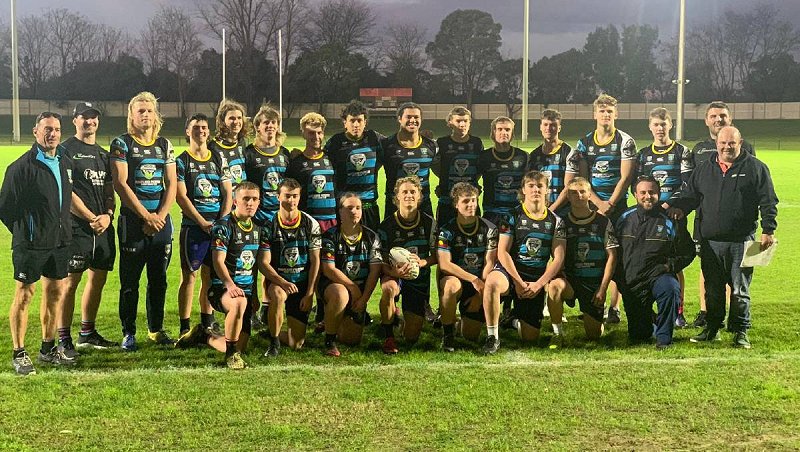 The St Mary's NRL Schoolboys Cup team is joined by Maitland Pickers and former students Matt Soper-Lawler and Jayden Butterfield. Picture: Supplied.