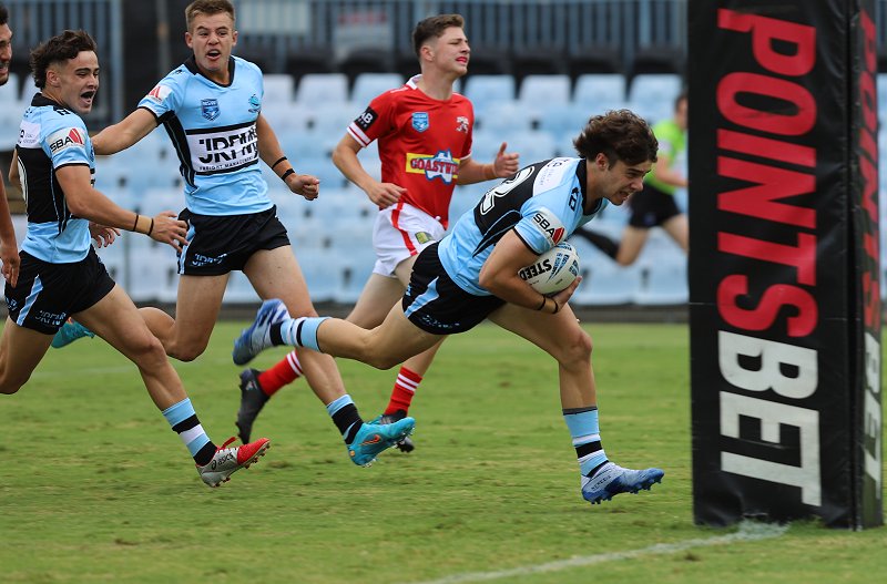 The 12 schoolboys talents that have rugby league in their blood (Photo : Jasper Catton dies in for a try for the Cronulla Sharks Photo : Steve Montgomery)