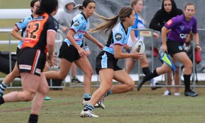 Sharks Lisa Fiaola Cup Five-eight Olivia Herman runs through the Weststigers defence during yesterday's Gala Day at Tuggerah (Photo : Steve Montgomery)