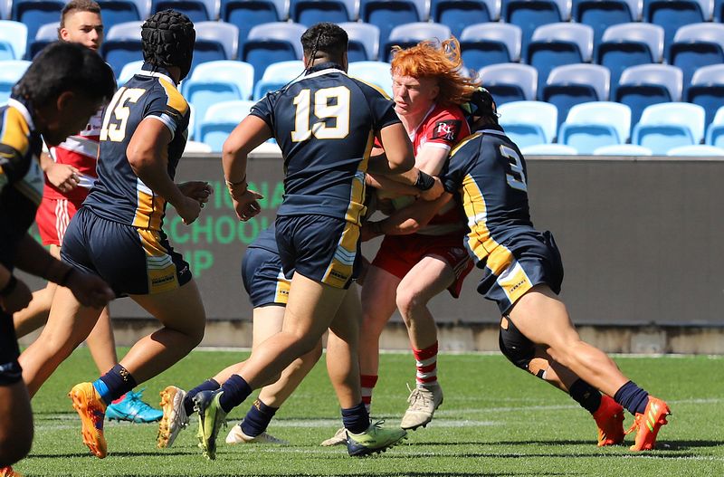 Baylen Donald gets tackled by the Westfields defence in the National Schoolboy Cup Final (Photo - Steve Montgomery)