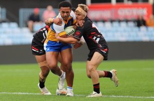 Marcellus Iakopo bursting through to score for Patrician Brothers. Photo: Steve Montgomery