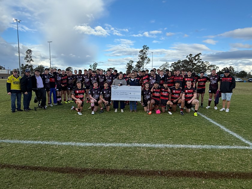 The Dalby Devils present the $10,000 donation to the McGrath Foundation. (Photo : QRL)
